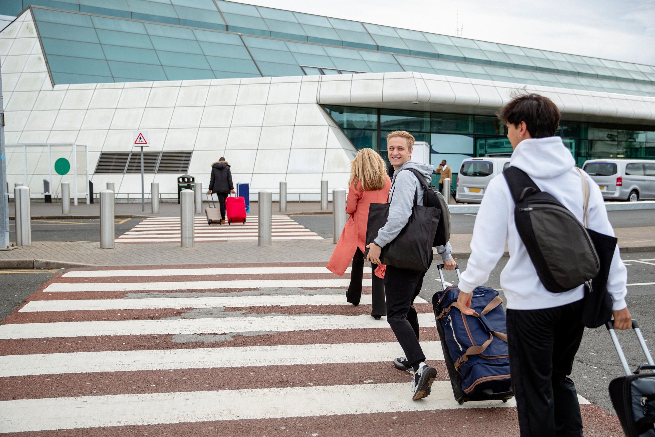 Traveler walking toward airport terminal
